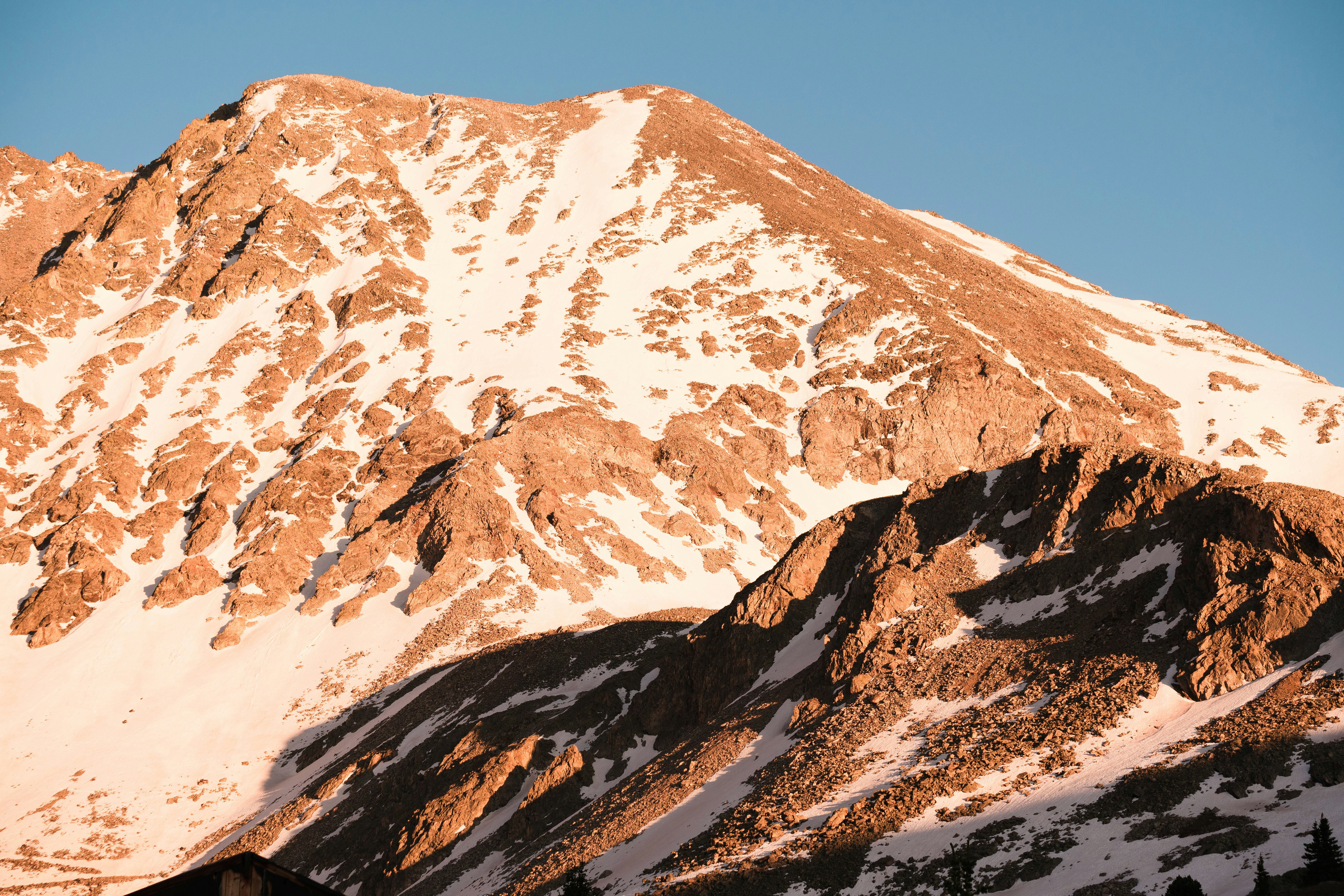 snow covered mountain under blue sky during daytime